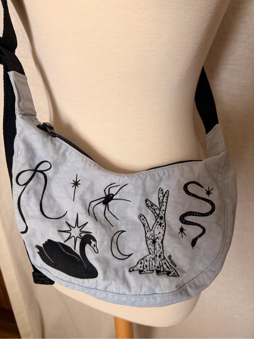 BAGGU Light Blue Embroidered Crescent Crossbody with Black Motifs